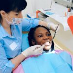 A dentist examining a patient.